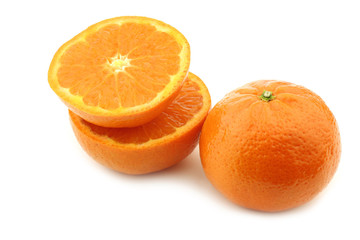fresh tangerine and a cut one on a white background
