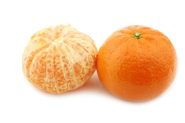 fresh tangerine and a peeled one on a white background
