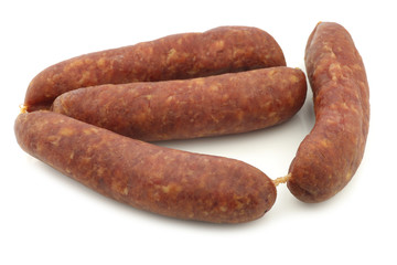 traditional Dutch smoked and dried sausages on a white background

