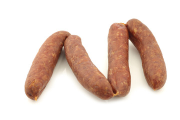 traditional Dutch smoked and dried sausages on a white background
