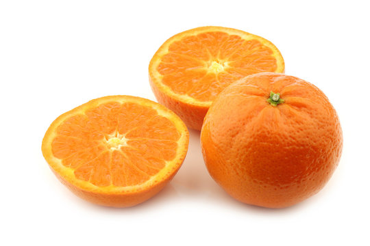 fresh tangerine and a cut one on a white background
