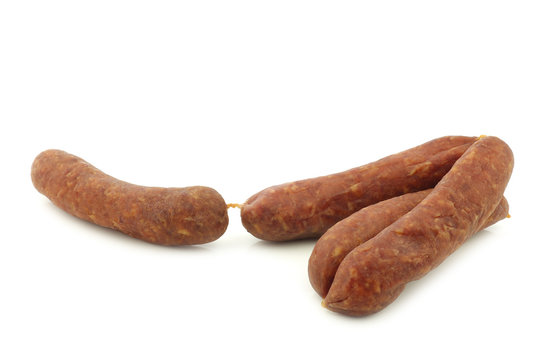 traditional Dutch smoked and dried sausages on a white background
