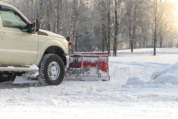 car pickup cleaned from snow by a snowplough during wintertime