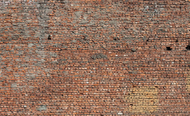 texture of old grunge dirty brick wall with peeling plaster