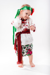 Beautiful Ukrainian little girl in native costume on Slavic holi