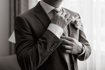 Hands of the groom