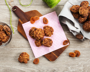 homemade cookies stuffed with dried apricot slices over wood