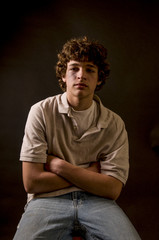 Moody shot of battered, lonely teenage boy