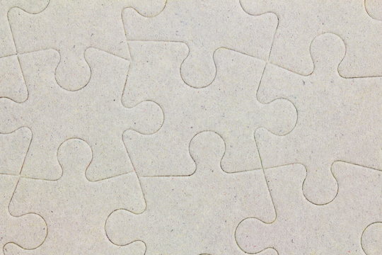 Connected blank jigsaw puzzle pieces as background