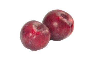 red plums isolated on white