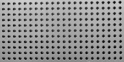 the black and white of the hole pattern on metal sheet