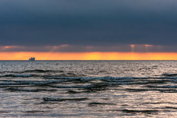 Sunset,the ship on the horizon.