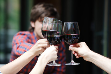 Friends clink glasses
