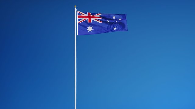 Australia flag waving in slow motion against clean blue sky, seamlessly looped, long shot, isolated on alpha channel with black and white luminance matte, perfect for film, news, digital composition