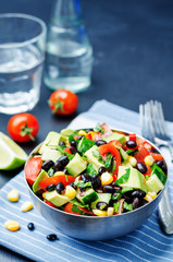 Black beans corn avocado cucumber tomato salad with lime dressin