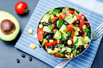 Black beans corn avocado cucumber tomato salad with lime dressin