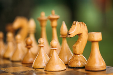 Old Chess Standing On Chessboard