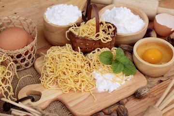 Making noodle with wheat flour and egg for cooking.