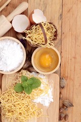 Making noodle with wheat flour and egg for cooking.