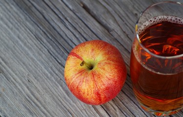 healthty apple juice drink. red apple gala on wooden background. 