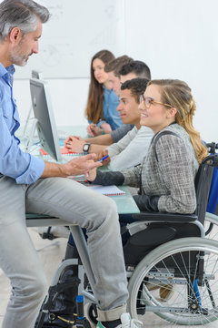 Teacher with studants, one disabled