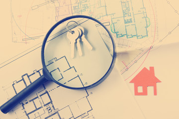 Model house, construction plan for house building, keys. Real Estate Concept. 