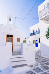 Mykonos whitewashed street and ancient church, Mykonos, Cyclades, Greece.
