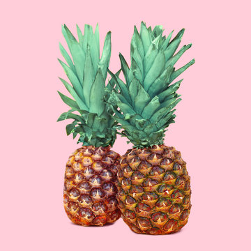 Two pineapple on colorful pink background, ananas concept