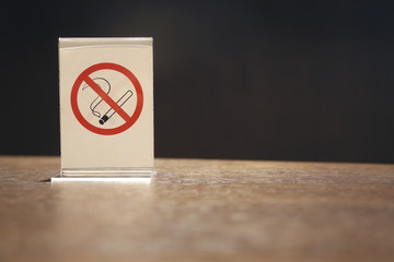 No smoking sign symbol on wooden table