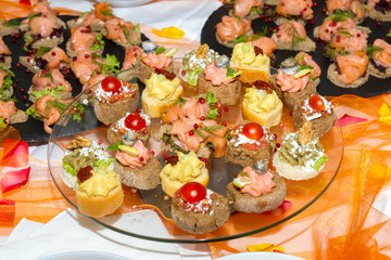 Buffet reception finger food appetizers with smoked salmon servi