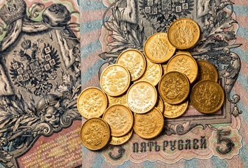 Gold and silver coins of the Russian Empire in the background ko
