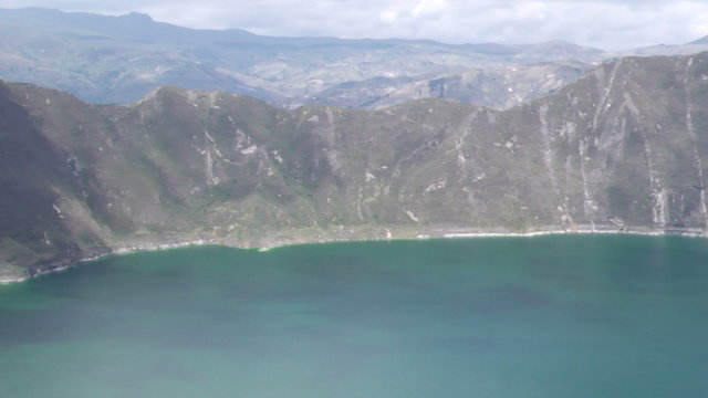 Experience a breathtakingly fast pan over the stunning Quilotoa Lagoon nestled in the majestic Ecuadorian Andes,a must visit destination.