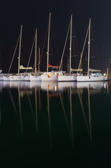 Marina with docked yachts at night in Hurghada, Egypt