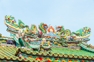 Two dragon sculpture Chinese style in the roof of Chinese temple.