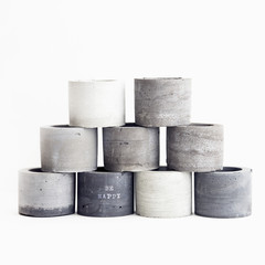 Handmade concrete planters for succulents in grey shades. Scandinavian minimalistic design for home.