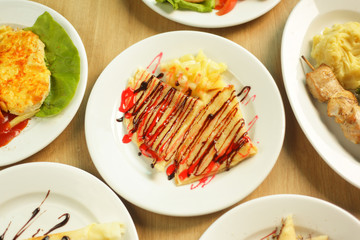 pizza and many delicious dishes on the table..