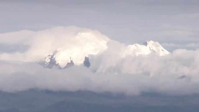 Experience a breathtaking time lapse of the majestic Cayambe volcano in Ecuador,captured with a super telephoto lens.