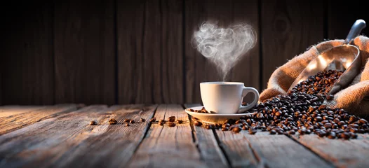 Foto op Plexiglas Traditional Coffee Cup With Heart-Shaped Steam On Rustic Wood   © Romolo Tavani
