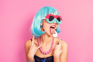 Pop girl portrait wearing weird sunglasses and blue wig - obrazy, fototapety, plakaty