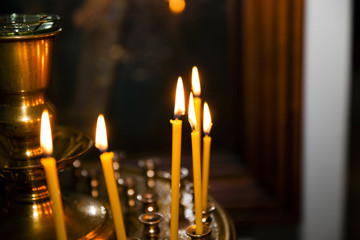 Lighted candles on  church  