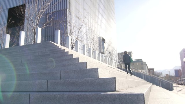 People walk up the steps into the Salt Lake City Federal Courthouse.