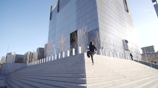 People walk up the steps into the Salt Lake City Federal Courthouse.