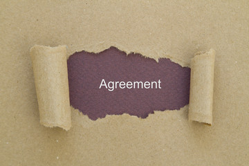 Agreement written under torn paper.
