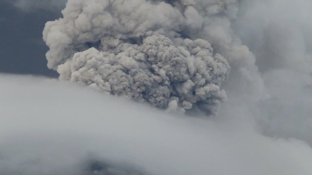 Witness the awe inspiring might of Ecuador's Tungurahua volcano as it unleashes a powerful explosion,engulfing the surroundings in dense clouds of ash and glass fragments.