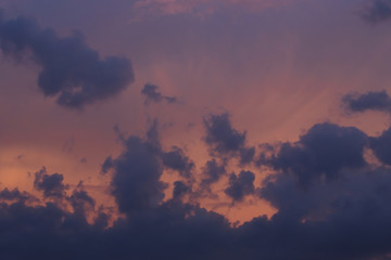 Fototapeta na wymiar black rain cloud on sunset sky background
