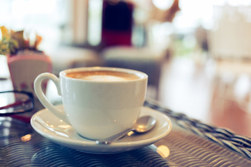 coffee cup on table with blur interior cafe coffee shop