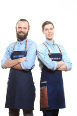 two bartender with a shaker and bottle on white background. behind the bar