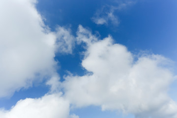 fluffy cloud above blue sky background