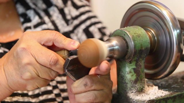 The seed is securely fixed in a lathe,initiating the shaping process for optimal results.