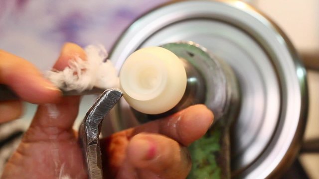 Close up shot of the skilled artisan's hand meticulously working with a chisel,creating intricate and exquisite craftsmanship.